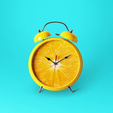 Creative idea layout fresh orange slice alarm clock on blue background. minimal idea business concept. Healthy lifestyle concept