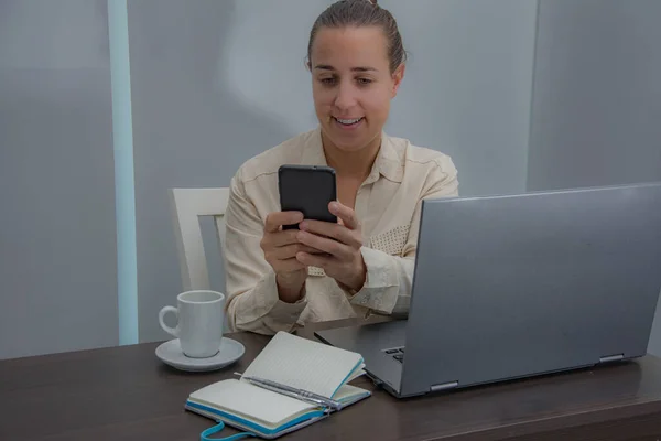 Female administrative working in the office and answering the phone