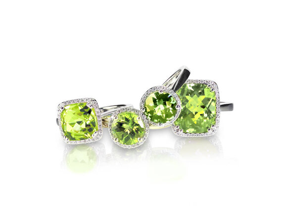 Set of green peridot diamond rings gemstone fine jewelry. Group stack or cluster of multiple gemstone diamond rings.