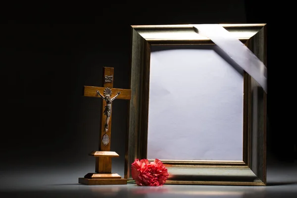 Blank mourning frame for condolence card on dark background