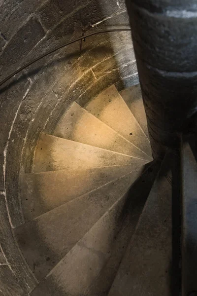 old wooden staircase with a spiral