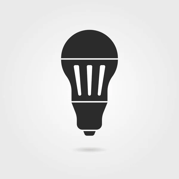 Icône ampoule led noire avec ombre — Image vectorielle