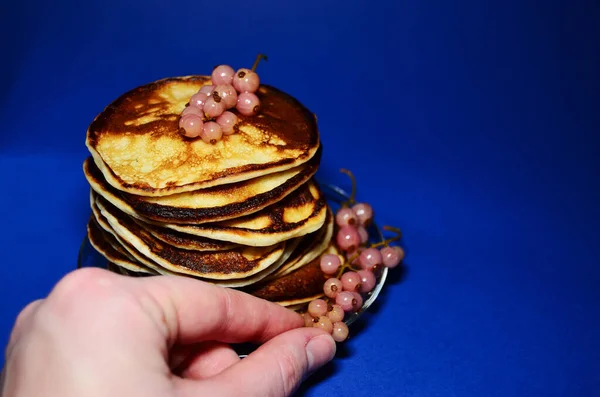 Stack Pancakes Berries Hand Blue Background Horizontal Orientation Copy Space — Stock Photo, Image