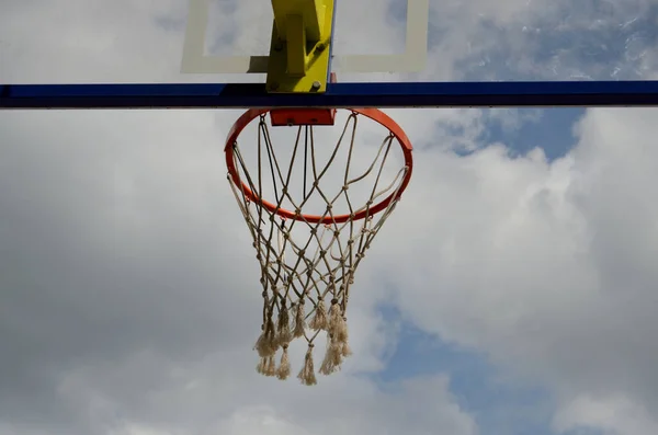 Basketball ring close-up against cloudy cloudy sky — Stock Photo, Image