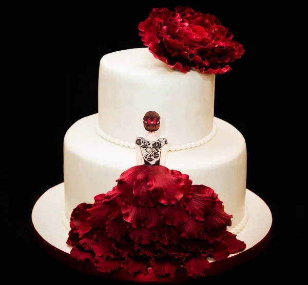 white cake with red flowers