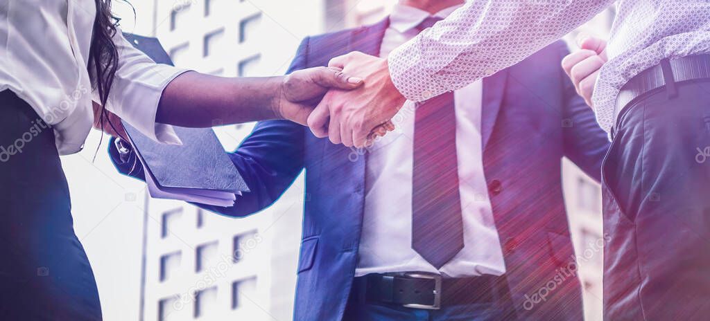 handshake of business People Colleagues Teamwork Meeting .Hold hand and shaking hand in city