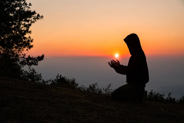 Silhouette of christian man hand praying — 스톡 사진