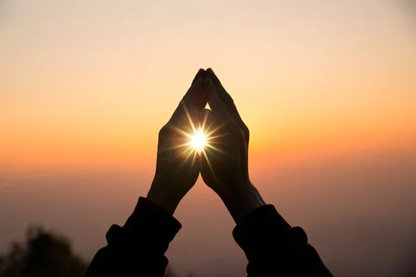 Silhouette of christian man hand praying — Stock Photo, Image