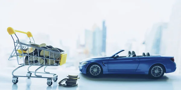 Saving money in Cart for car loan. Unidentified Miniature toy sport Convertible Luxury car model. Super car worth every cent or penny. Transportation is germany vehicle company in global.