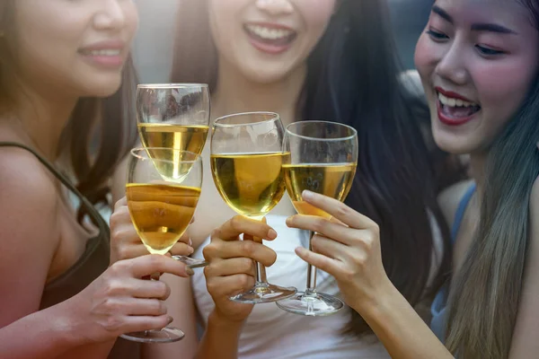 Party time start. Happy people toasting with champagne flutes. Multiethnic friends congratulating each other with new year. Celebration holiday concept, holiday background. selective focus.