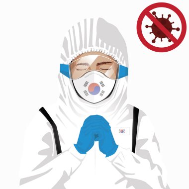 Covid-19 veya Coronavirus konsepti. Koreli tıbbi personel koruyucu giysiler içinde maske takıyor ve Kore 'de Covid-19 virüsü salgınına karşı dua ediyor. Koreli adam ve Kore bayrağı. Salgın Korona Virüsü