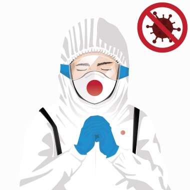 Covid-19 veya Coronavirus konsepti. Japon sağlık personeli koruyucu giysiler içinde maske takıyor ve Japonya 'da Covid-19 virüsü salgınına karşı dua ediyor. Japon adam ve Japon bayrağı. Salgın Korona Virüsü