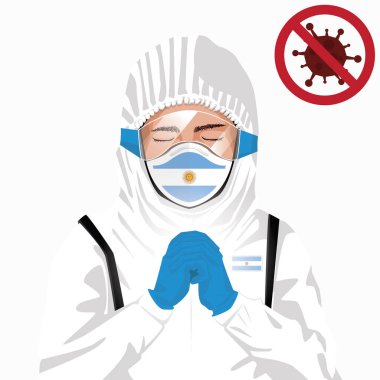 Covid-19 veya Coronavirus konsepti. Arjantin sağlık personeli koruyucu giysiler içinde maske takıyor ve Arjantin 'deki Covid-19 virüs salgınına karşı dua ediyor. Arjantin adamı ve Arjantin bayrağı. Pandemik korona virüsü