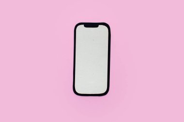 Kağıt işi telefon. Pembe arkaplan. 