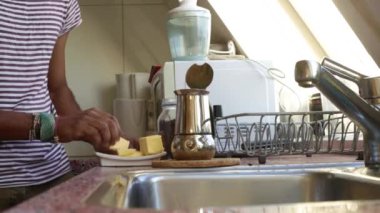 Low view person making bulletproof coffee in the morning