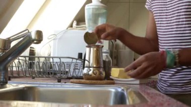 Low view person making bulletproof coffee in the morning