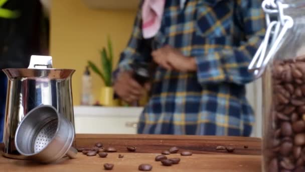 Person Manually Grinding Roasted Coffee Beans Home — Stock Video