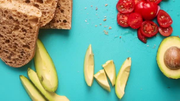 Flat Lay Person Making Avocado Tomato Tartine Sandwich — Stock Video