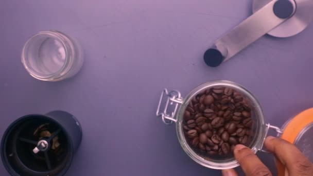 Flat Lay Person Manually Grinding Roasted Coffee Beans — Stock Video