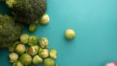 chef preparing brussel sprouts and broccoli
