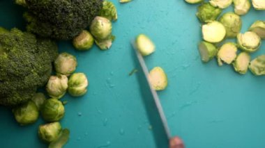 chef preparing brussel sprouts and broccoli
