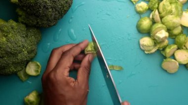 chef preparing brussel sprouts and broccoli