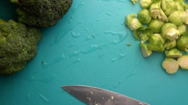 chef preparing brussel sprouts and broccoli