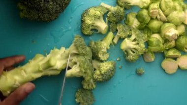 chef preparing brussel sprouts and broccoli