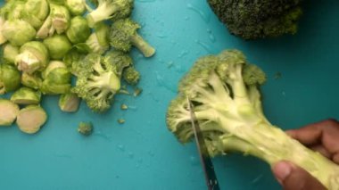 chef preparing brussel sprouts and broccoli