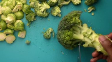 chef preparing brussel sprouts and broccoli