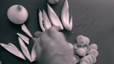 close-up of person hands preparing avocado and cherry tomatoes                 