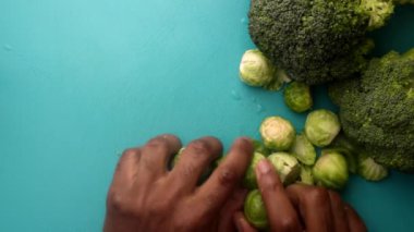 chef preparing brussel sprouts and broccoli