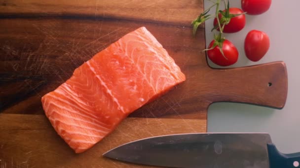 Person Preparing Salmon Broccoli Wooden Board Kitchen — Stock Video