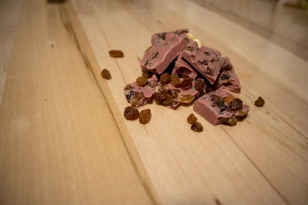 Pink Chocolate. Chocolate with nuts, raisins and cranberries.
