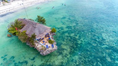 Rock Restaurant over the sea in Zanzibar, Tanzania, Africa. clipart