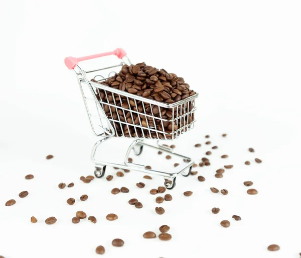 Coffee beans inside small shopping cart on white background — Stock Photo, Image