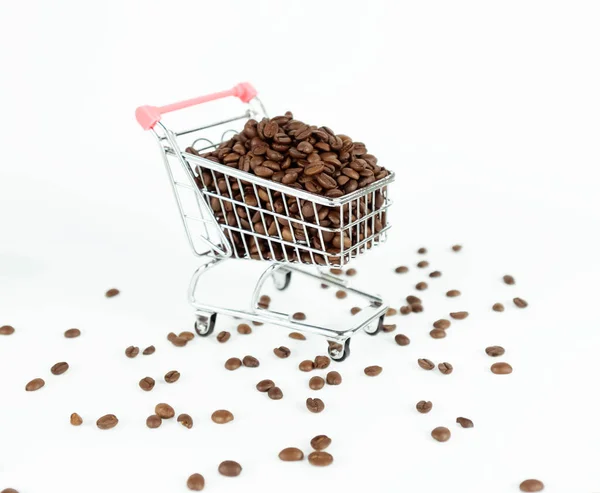 Coffee beans inside small shopping cart on white background — Stock Photo, Image