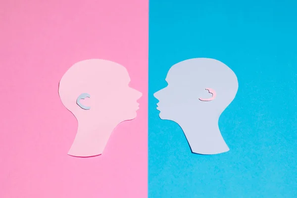 Two Human Profiles Cut Out Paper Look Each Other Pink — Stock Photo, Image