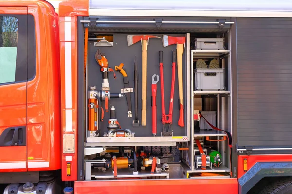 A fire truck with an open tool. Axe, bolt cutter, spreader.