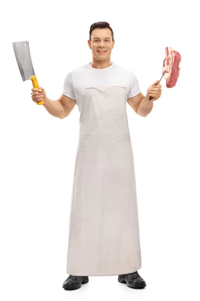 Butcher holding a cleaver and a fork — Stock Photo, Image