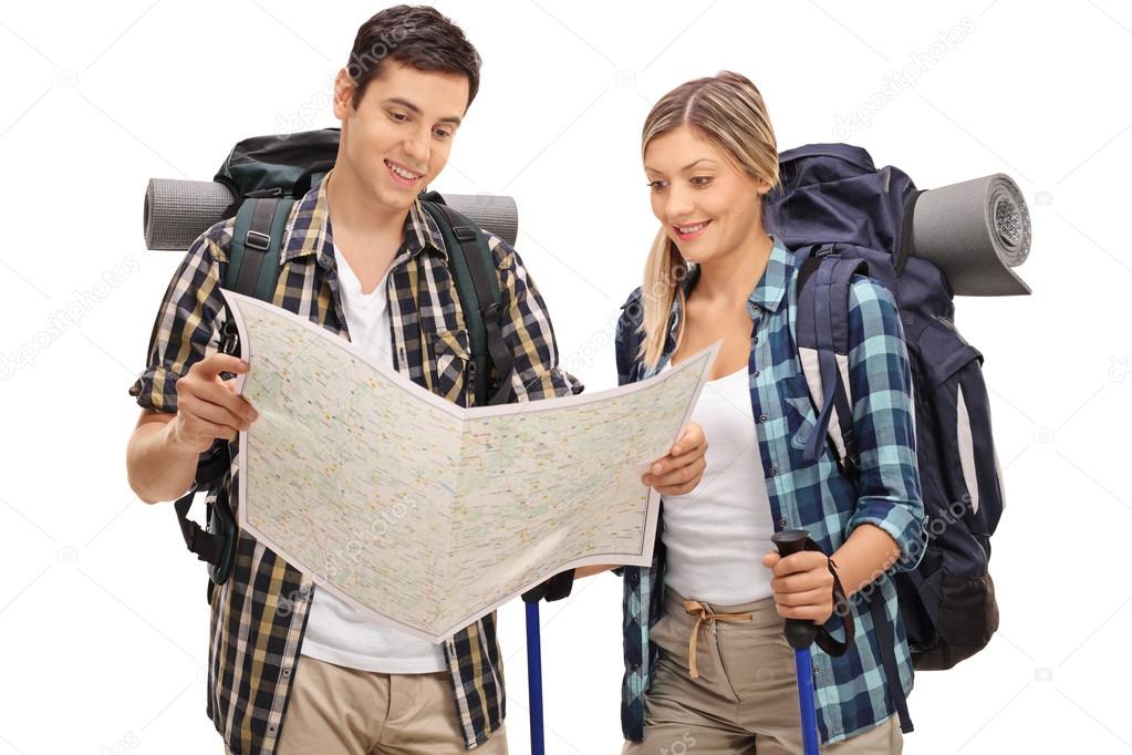 Young hikers looking at a generic map