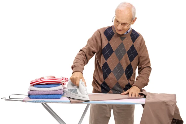 Joyful mature man ironing — Stock Photo, Image