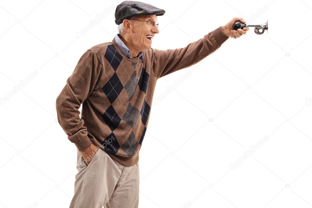 Excited elderly man honking a horn