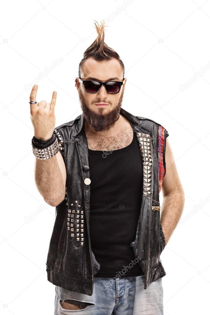 Young punker doing a rock hand gesture