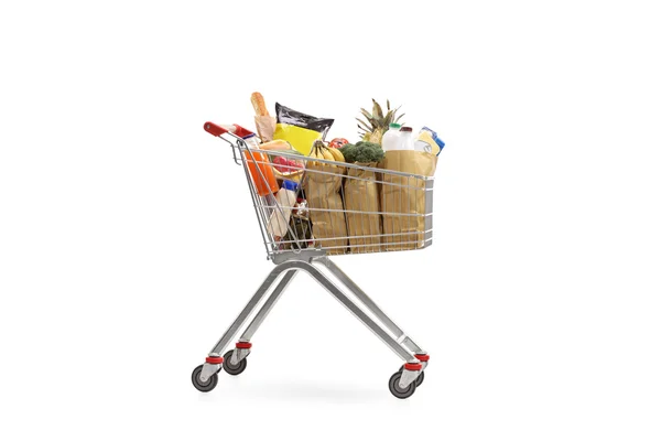 Nákupní košík naplněn potraviny — Stock fotografie