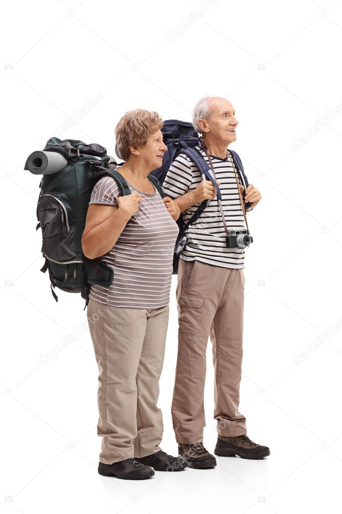 Two elderly hikers looking in the distance