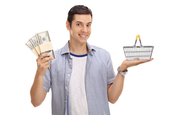 Guy holding shopping basket and money bundles