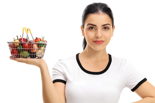 Woman holding a small shopping basket — Stock Photo, Image
