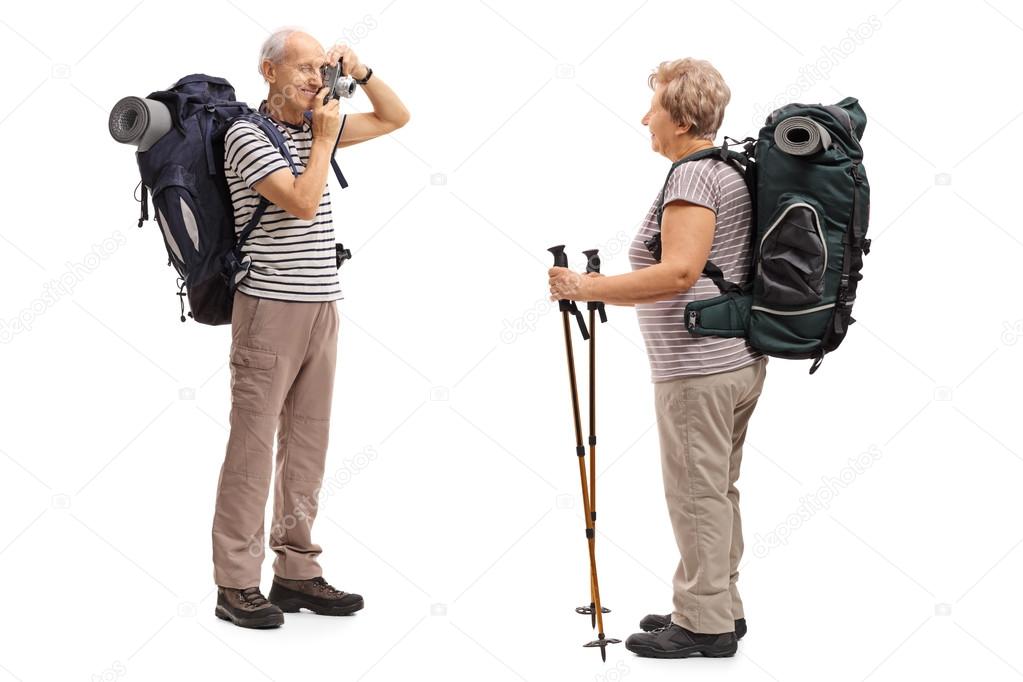 Male hiker taking a picture of a female hiker