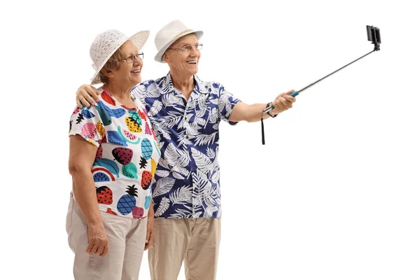 Mature tourists taking a selfie with a stick — Stock Photo, Image